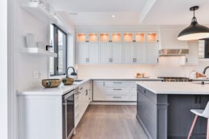 Modern white kitchen cabinet design with island and storage solutions for contemporary homes in Canada