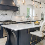 Kitchen Cabinets Oakville in a luxury modern kitchen with navy island and white cabinetry