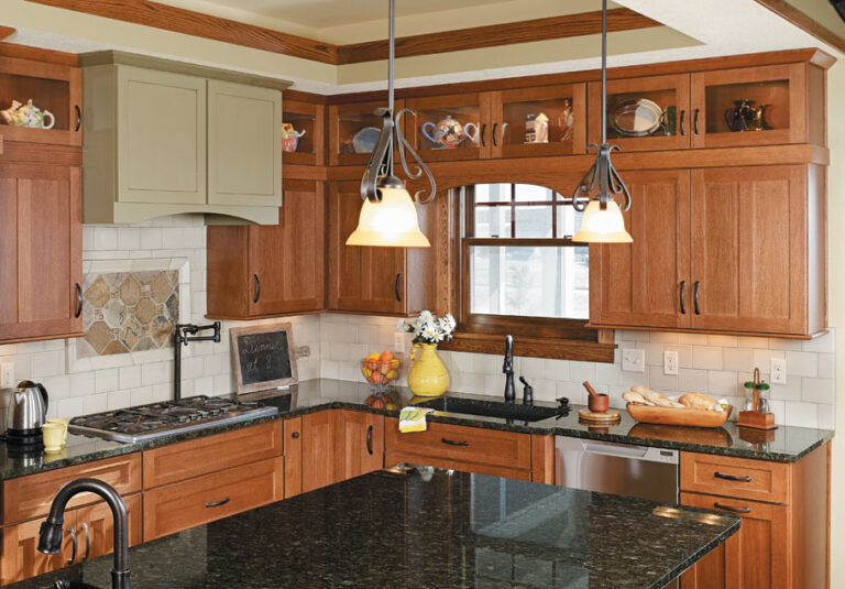 modern wooden kitchen cabinet design with glass upper cabinets and black countertop