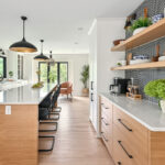 Modern RTA kitchen cabinets with wood finish, white countertops, and open floating shelves