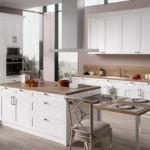 Flat pack kitchen cabinets in a modern Ontario kitchen with white shaker cabinets and island