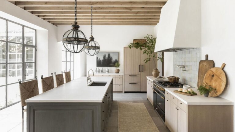 Warm minimalist kitchen with light wood cabinets, dark gray island, and white surfaces inspired by popular IKEA kitchen cabinet colors in Canada for 2026.