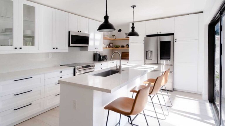 Common problems with IKEA kitchen cabinets in a bright modern white kitchen, including sizing limits, filler use, and long-term durability concerns