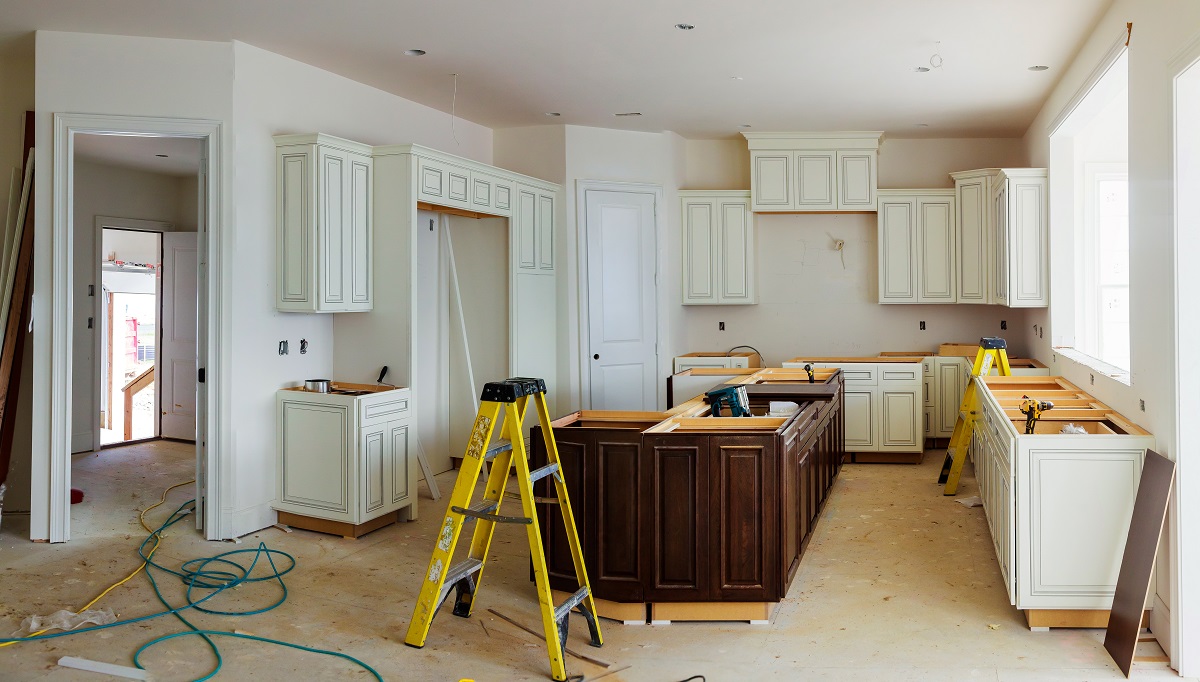 Finished kitchen cabinet installation after leveling cabinets on uneven floors and walls